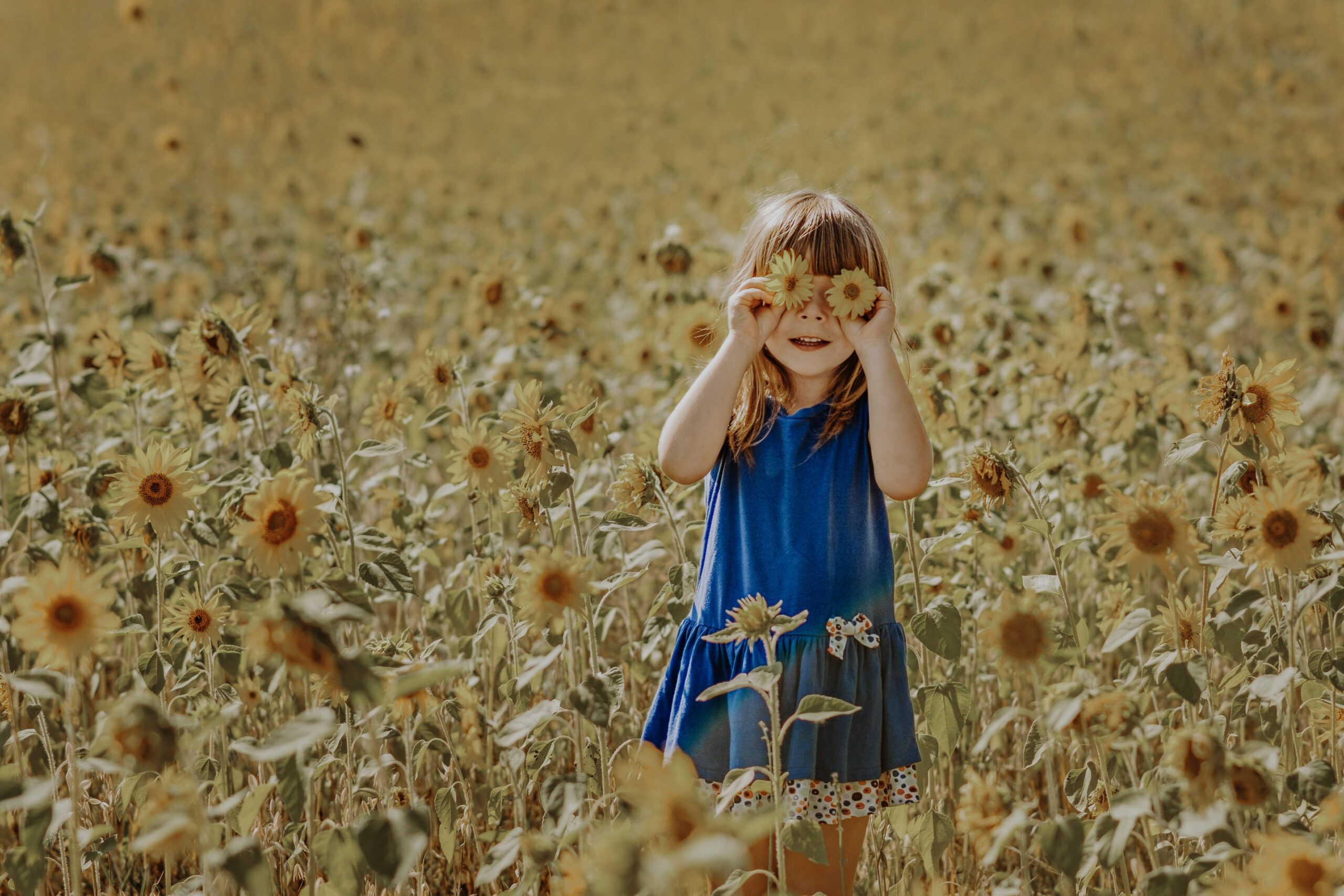 happy healthy detoxed girl in sunflower field
