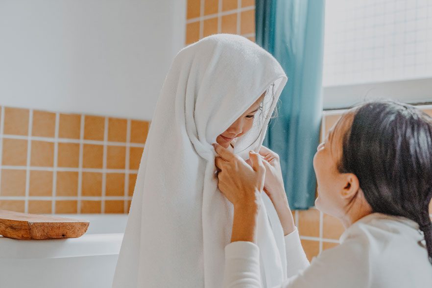 girl-taking-detox-bath little girl done taking a kids detox bath for heavy metals with mom in towel