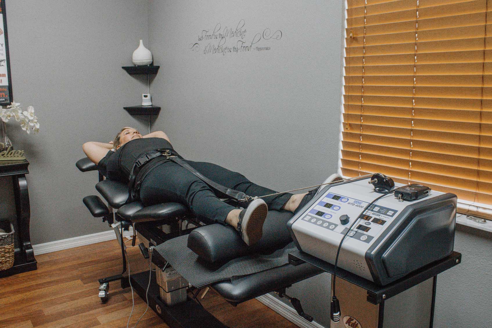 female patient undergoing spinal decompression therapy at westchase chiropractic